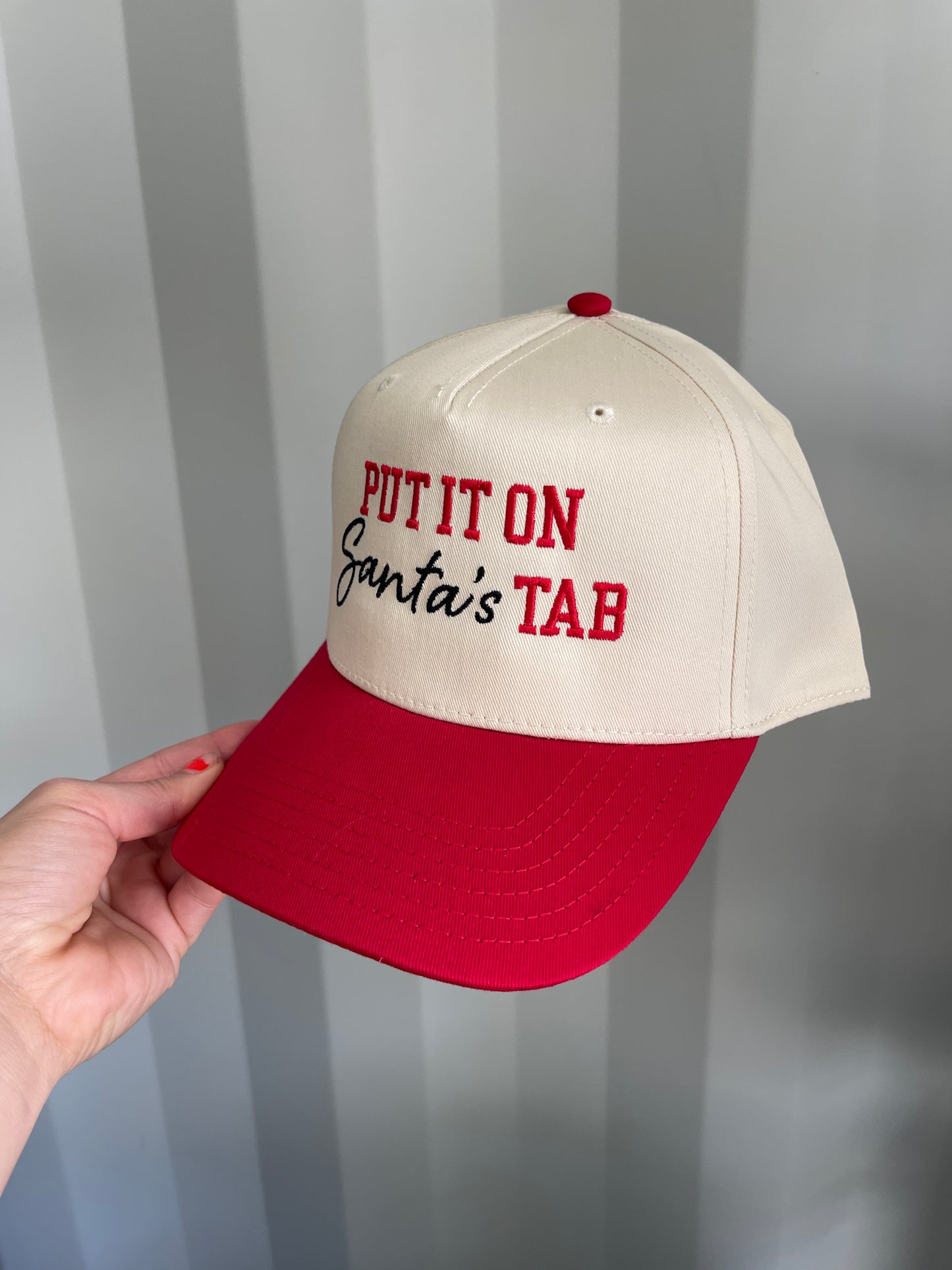 Put it on Santa’s tab Trucker Hat