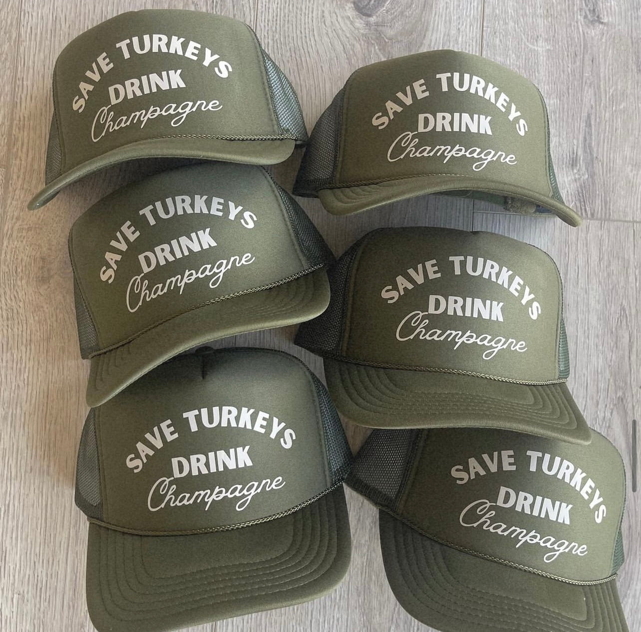 Save turkeys, drink champagne trucker hat