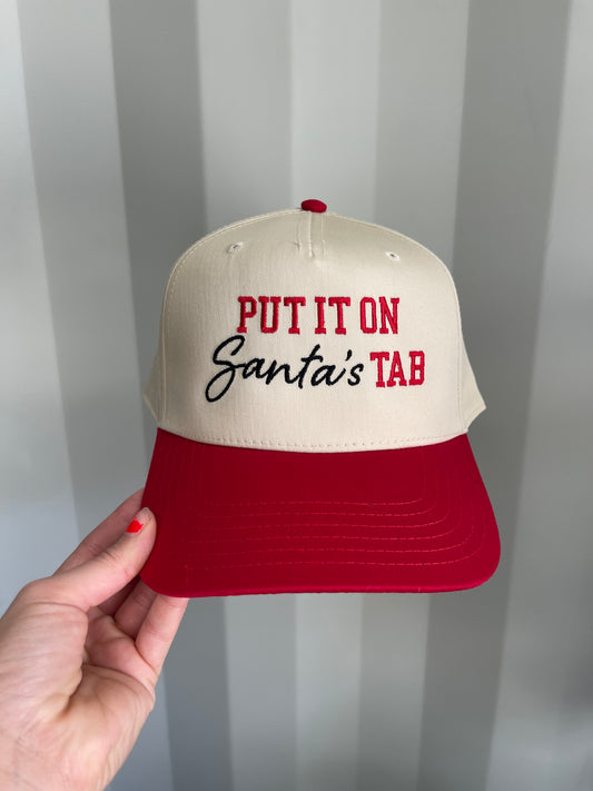 Put it on Santa’s tab Trucker Hat